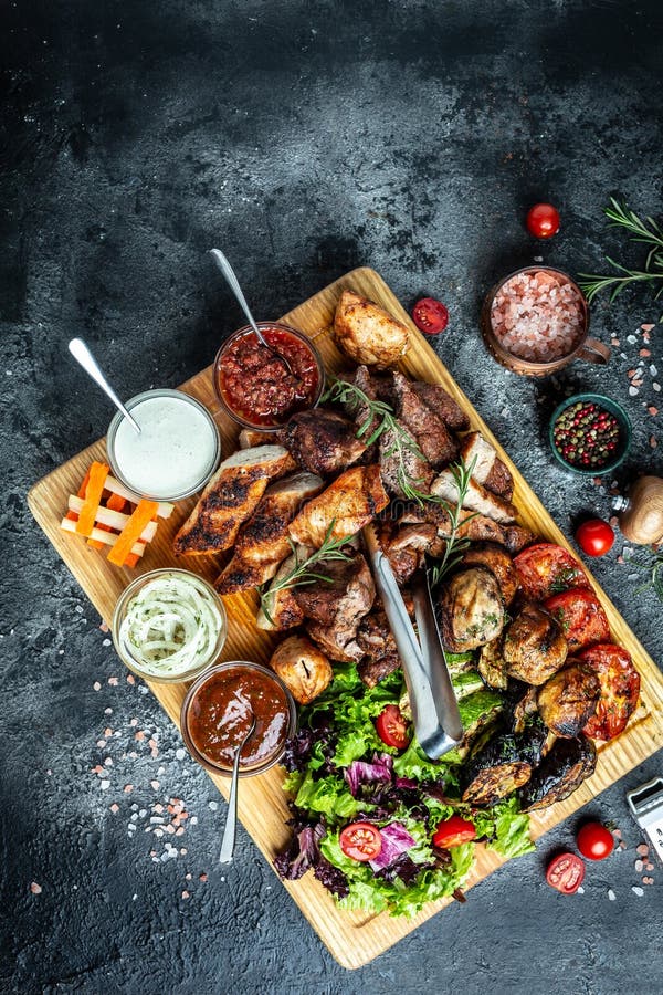 Photo for Complete mixed grill platter with three cocktails and your c